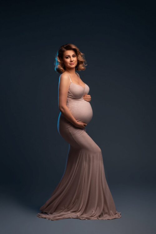 fitted maternity dress with thin straps mermaid silhouette studio portrait