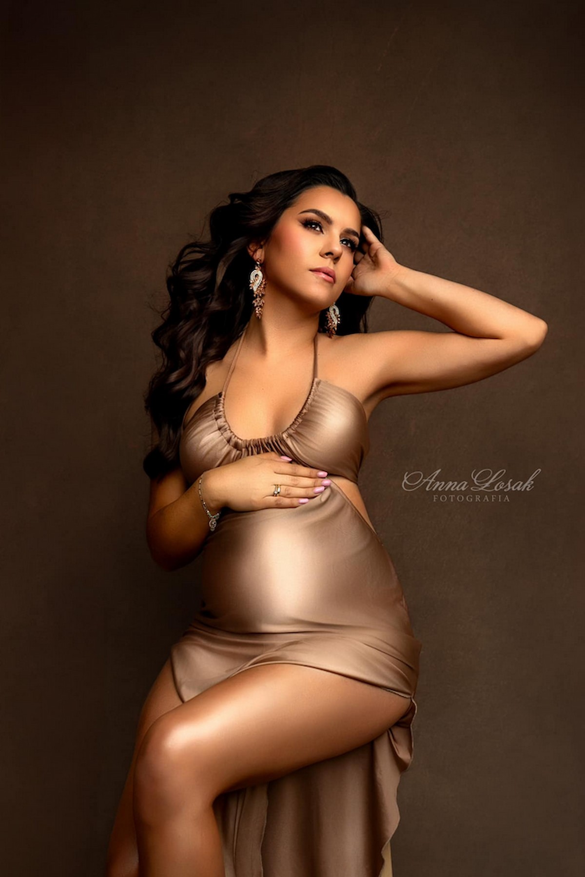 maternity dress with halter neckline and side cut-outs studio portrait