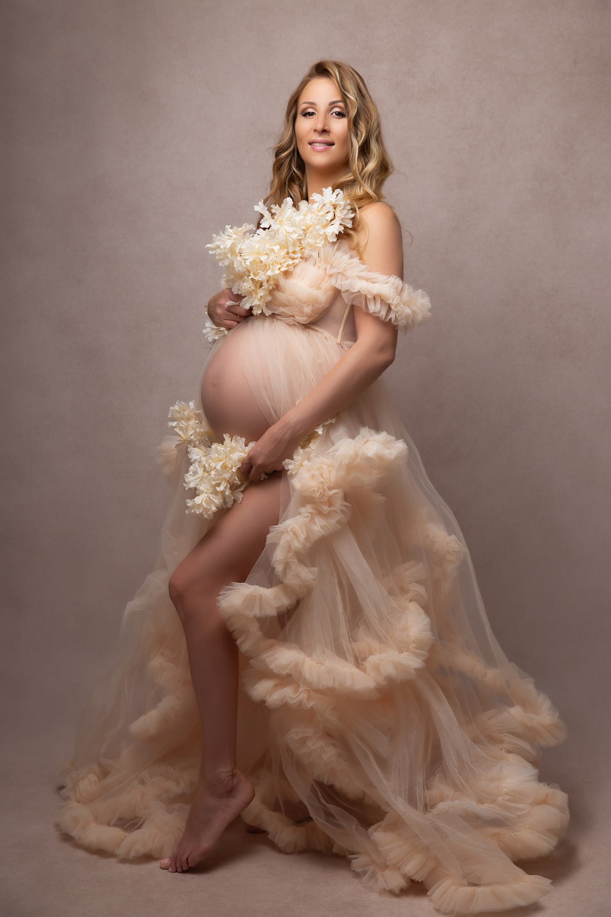 romantic maternity photoshoot gown with flowing tulle