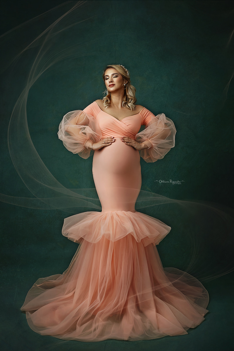 elegant maternity photoshoot in peach off shoulder mermaid dress