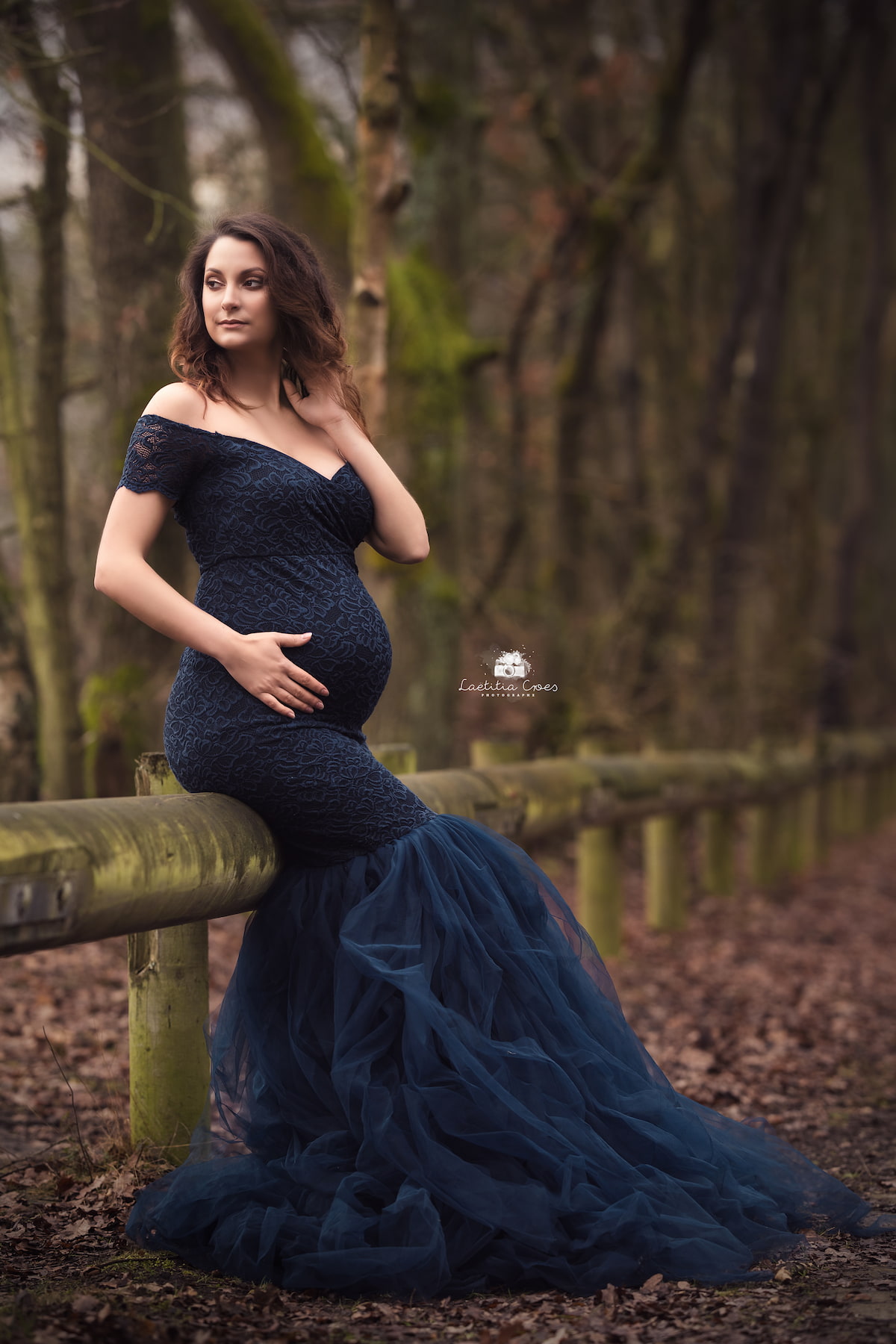 elegant maternity photoshoot in navy lace off shoulder gown