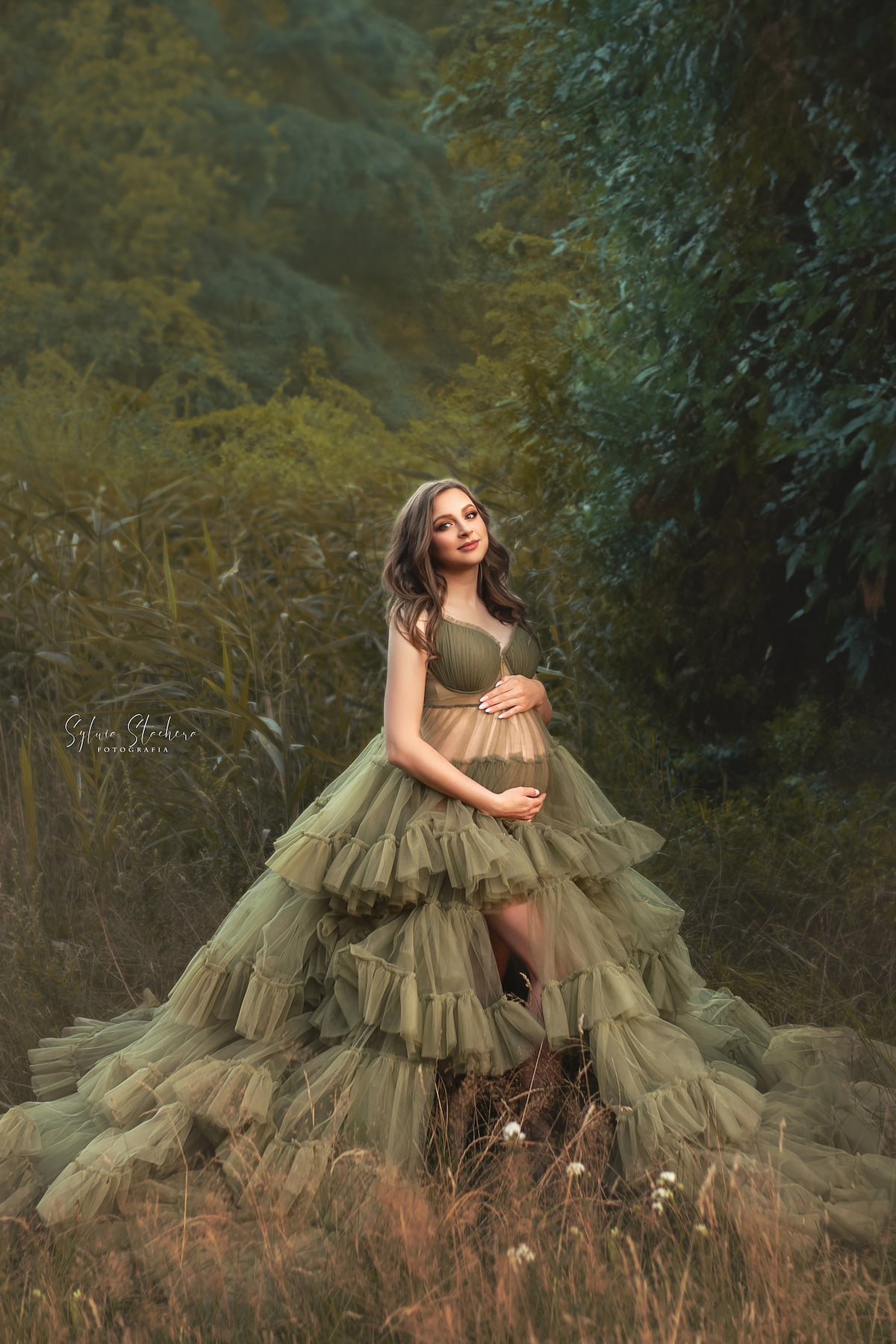 maternity photoshoot gown with long tulle train outdoors