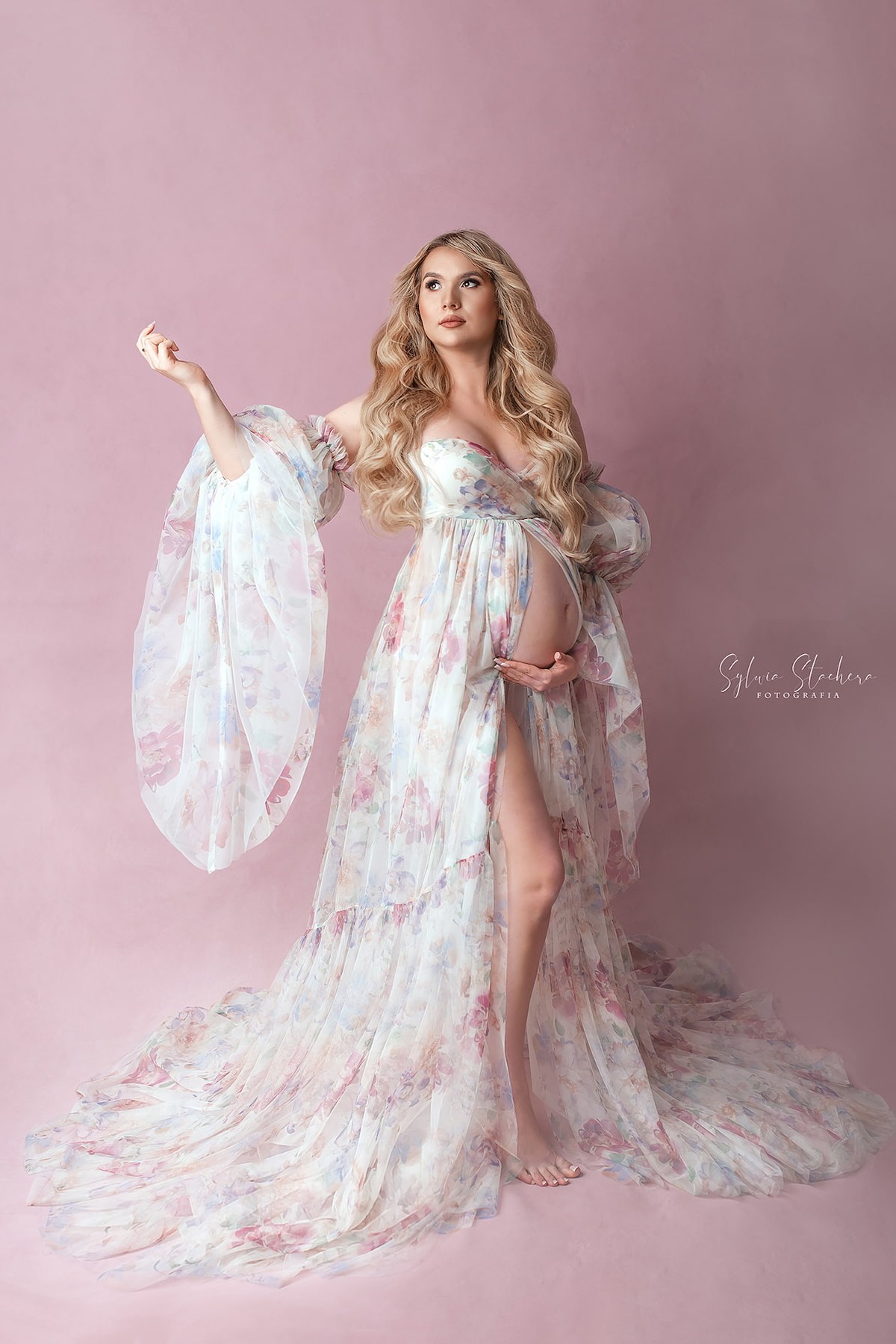 pregnant woman wearing pastel floral maternity gown