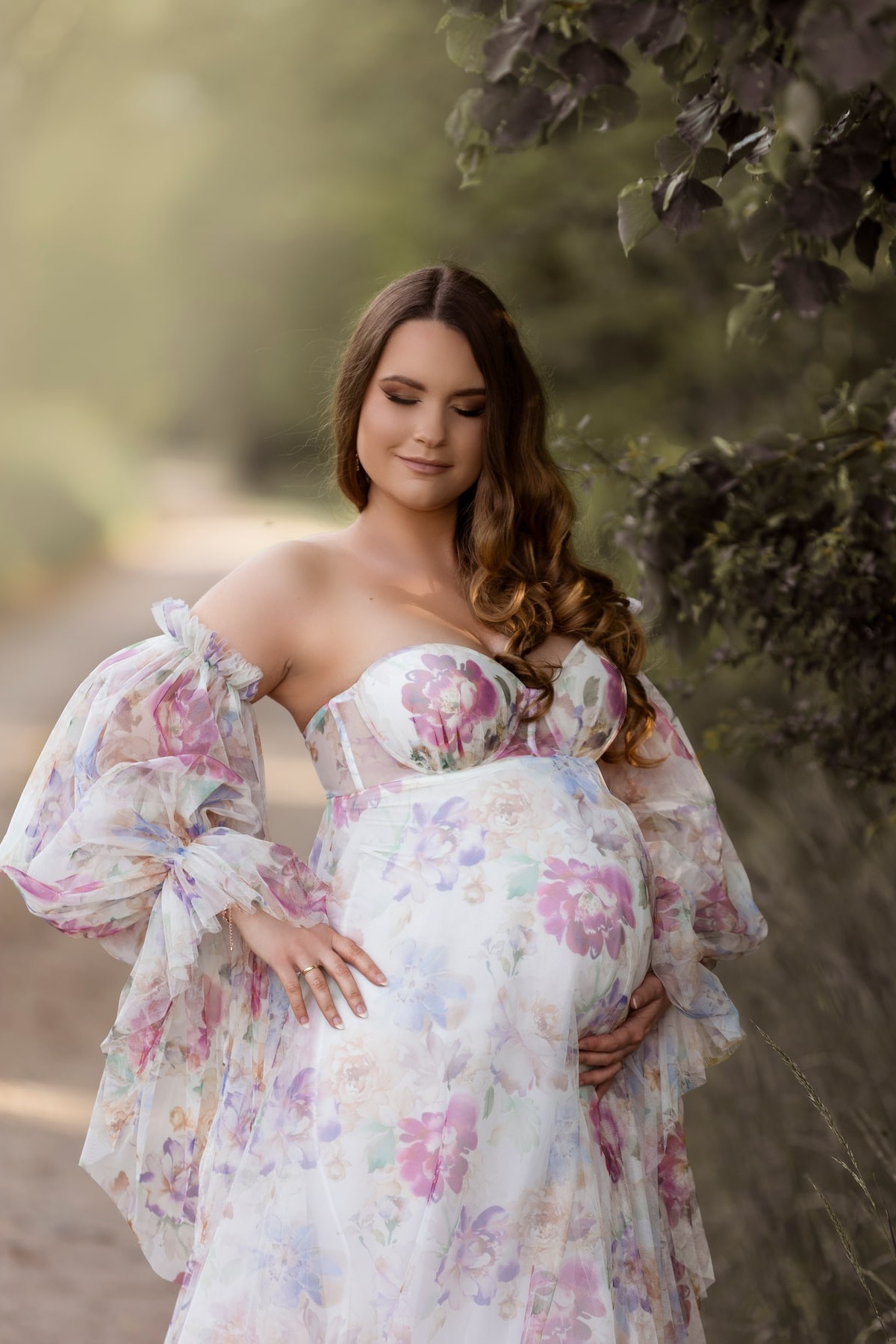Rosa maternity gown with flowing tulle layers and floral design, perfect for fine art outdoor photoshoots.