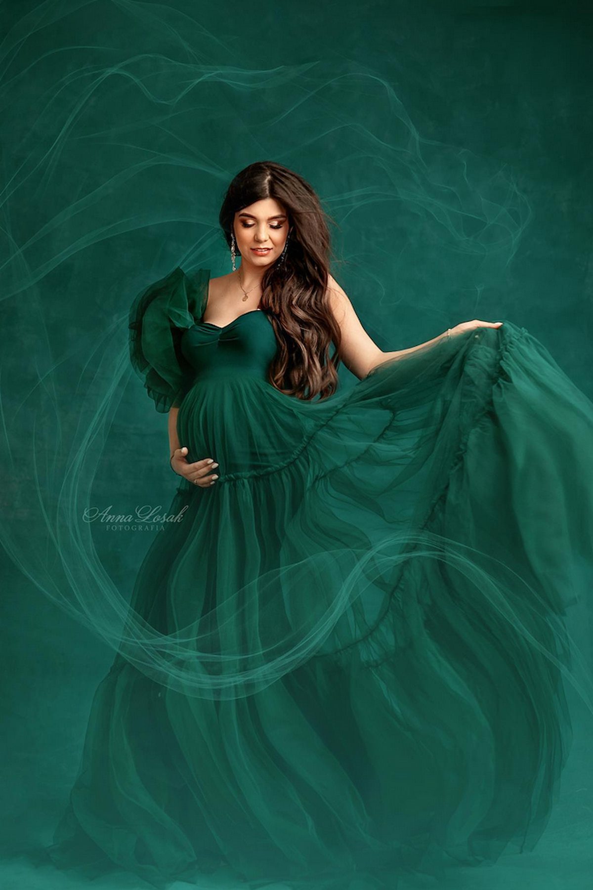 dramatic maternity gown with flowing tulle skirt