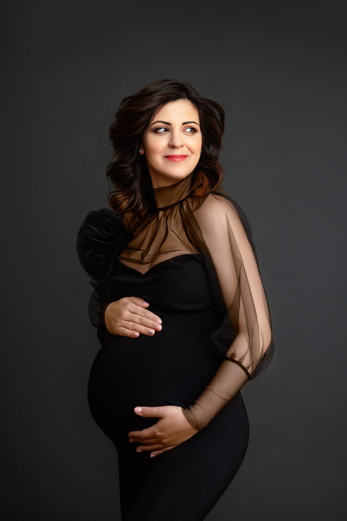 Pregnancy portrait with high neck transparent blouse