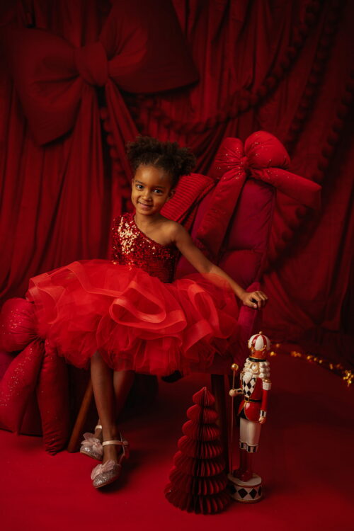 Red Belinda girls’ dress with sequin bodice and voluminous tulle skirt for Christmas photography